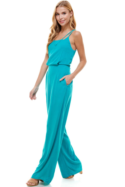 Nicolette Teal Jumpsuit. Spaghetti double strap with pockets. Elastic waistline.