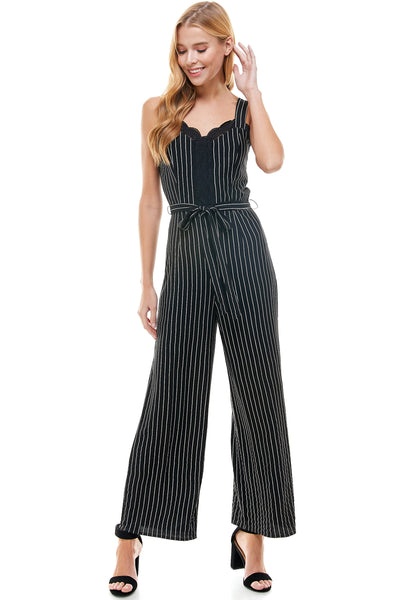 Abigail Jumpsuit in Navy pinstripe with Self Belt. Bust and center lace trim detail. Back hidden zipper closure.