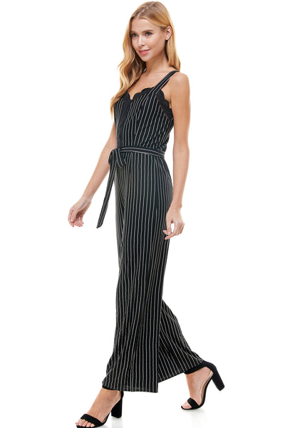 Abigail Jumpsuit in Navy pinstripe with Self Belt. Bust and center lace trim detail. Back hidden zipper closure.