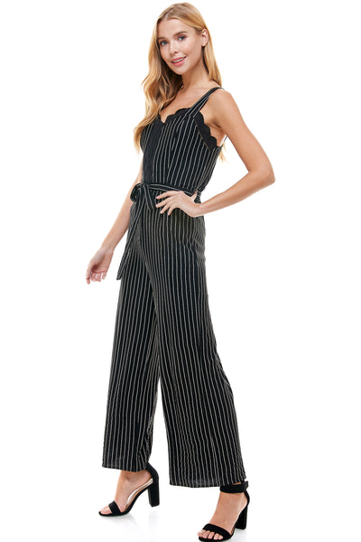 Abigail Jumpsuit in Navy pinstripe with Self Belt. Bust and center lace trim detail. Back hidden zipper closure.