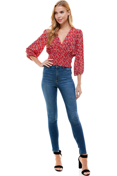 Veronica Long sleeve blouse in Red floral print. Plunging neck line with smocking at waist.