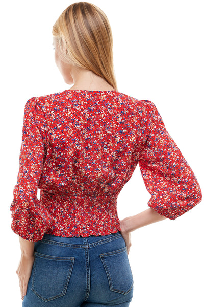 Veronica Long sleeve blouse in Red floral print. Plunging neck line with smocking at waist.